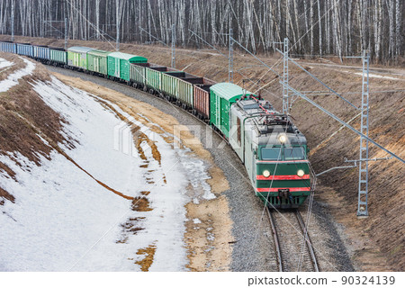 Freight train arrives to the station at winter day. Freight train arrives to the station at winter day. 90324139