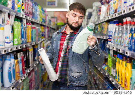 Man buying household detergents 90324146