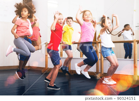Boys and girls jumping in dance studio Boys and girls jumping in dance studio 90324151