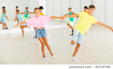 Portrait of children enjoying of partner dance in class 90324346