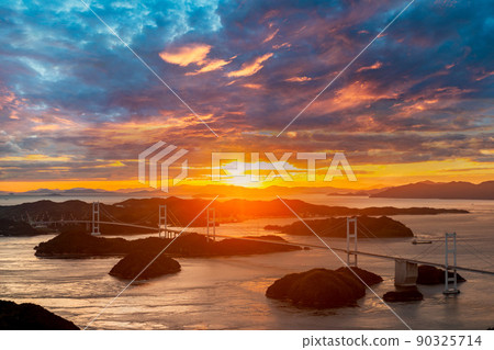 Sunset over the Kurushima Kaikyo Bridge 90325714