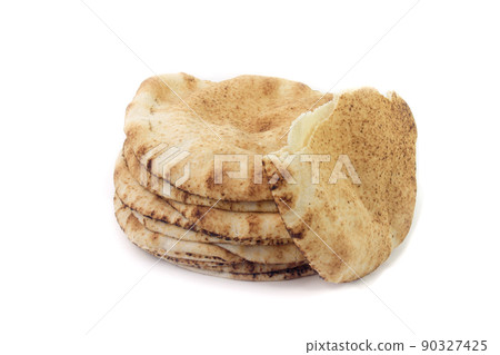 Pita bread isolated on white background. Traditional food of Arabic cuisine and culture Pita bread isolated on white background. Traditional food of Arabic cuisine and culture 90327425