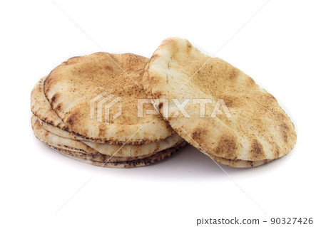 Pita bread isolated on white background. Traditional food of Arabic cuisine and culture Pita bread isolated on white background. Traditional food of Arabic cuisine and culture 90327426