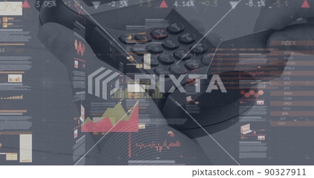 Image of graphs and financial data over hand of caucasian man holding payment terminal 90327911
