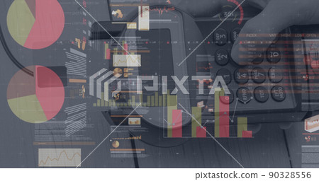 Image of graphs and financial data over hand of caucasian man holding payment terminal Image of graphs and financial data over hand of caucasian man holding payment terminal 90328556