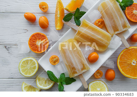 Natural juicy orange popsicles. Natural juicy orange popsicles. 90334683