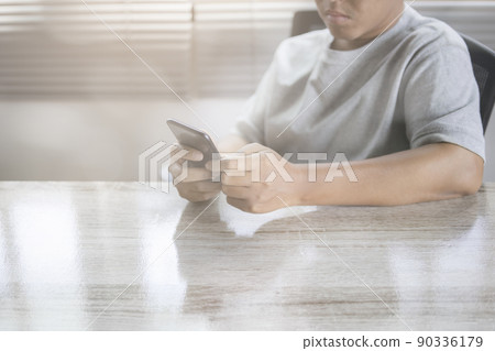 Man using smartphone. Man using smartphone. 90336179