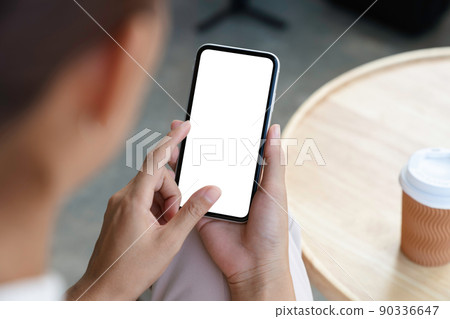 close-up a woman holding and touch smartphone blank screen close-up a woman holding and touch smartphone blank screen 90336647