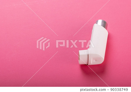High angle view of white asthma inhaler isolated against pink background, copy space 90338749
