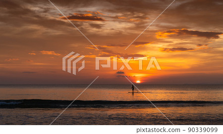 man surfing in the summer sunset 90339099