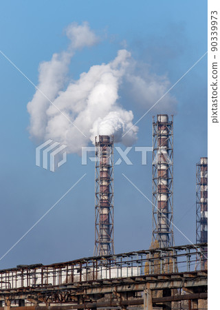 Smoke stack of coal power plant on blue sky background. 90339973