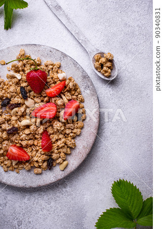 Homemade granola with fresh strawberry Homemade granola with fresh strawberry 90340831