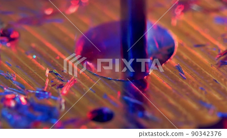 CNC machining of a hole in metal, macro shot CNC machining of a hole in metal, macro shot 90342376