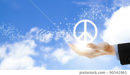 Hand holding peace sign icon of war on the sky background, International Peace Day, unity and assistance, stop the war. 90342961