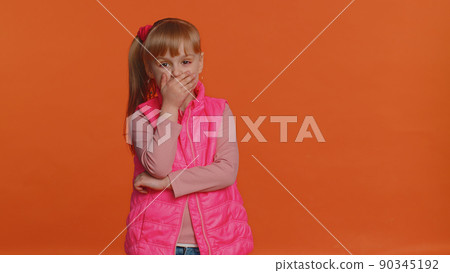 Frightened scared child girl closing his mouth gestures no, refusing to tell terrible secret, truth 90345192