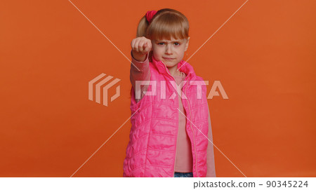 Greedy aggressive children girl showing fig negative gesture, refusal fig sign, rapacious avaricious 90345224
