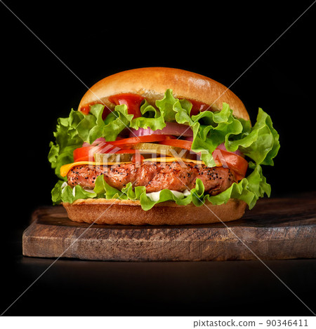Delicious burgers with beef, tomato, cheese and lettuce 90346411