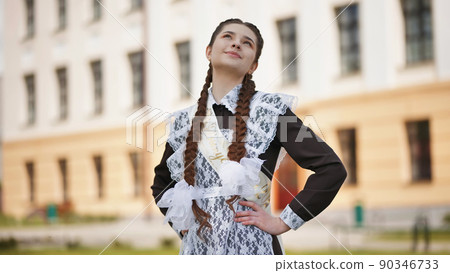 Happy Russian schoolgirl on the last day of school. 90346733
