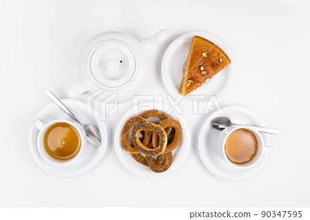 white tea set with teapot tea and saucers and pie for breakfast white tea set with teapot tea and saucers and pie for breakfast 90347595