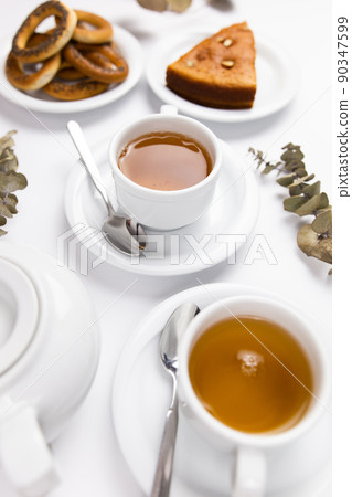 white tea set with teapot tea and saucers and pie for breakfast white tea set with teapot tea and saucers and pie for breakfast 90347599