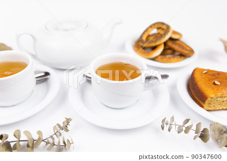 white tea set with teapot tea and saucers and pie for breakfast white tea set with teapot tea and saucers and pie for breakfast 90347600