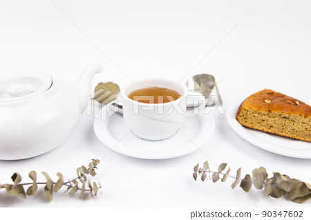 white tea set with teapot tea and saucers and pie for breakfast white tea set with teapot tea and saucers and pie for breakfast 90347602