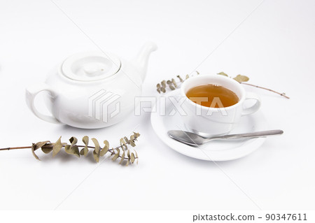 a white tea set with teapot tea and saucers and pie for breakfast a white tea set with teapot tea and saucers and pie for breakfast 90347611