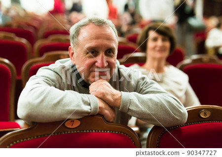 mature man watching play in the theater mature man watching play in the theater 90347727