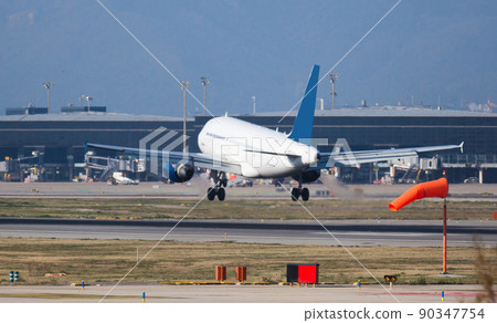 passenger plane lands at airport passenger plane lands at airport 90347754