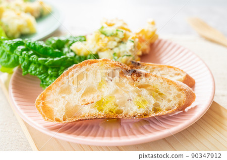 Sliced baguette and potato salad Sliced baguette and potato salad 90347912