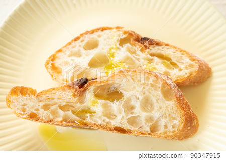 Baguette and olive oil Baguette and olive oil 90347915