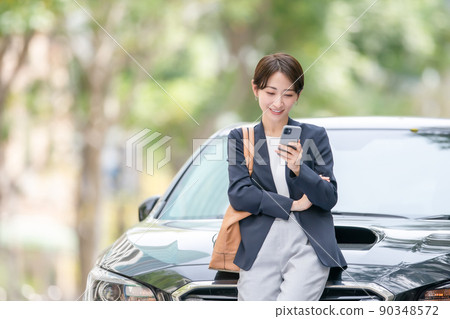 Business car roadside tree woman 90348572