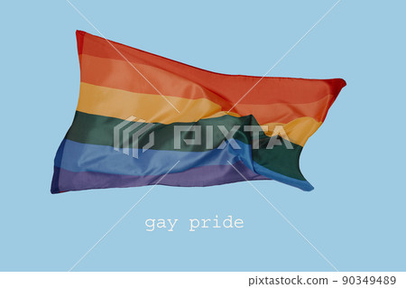 rainbow flag and text gay pride on blue background 90349489