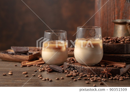 Cream and coffee cocktail in glasses with ice. 90351509