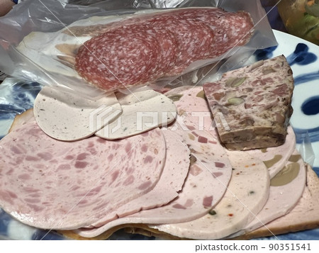 Salami, prosciutto and terrine on a plate 90351541