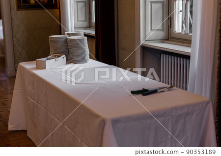 table with plates for cake in a restaurant on a holiday table with plates for cake in a restaurant on a holiday 90353189