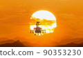 Helicopter flying over the mountains at sunset, hot weather, heat distortion 90353230