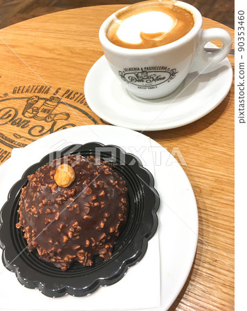 Chocolate and nut sweets and cappuccino Chocolate and nut sweets and cappuccino 90353460