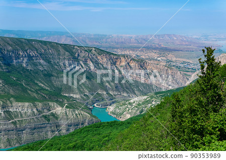 mountain landscape in the Caucasus with a view of the valley of the Sulak River, the Miatli hydroelectric power station and the towns of New Zubutli and Kizilyurt in the distance 90353989