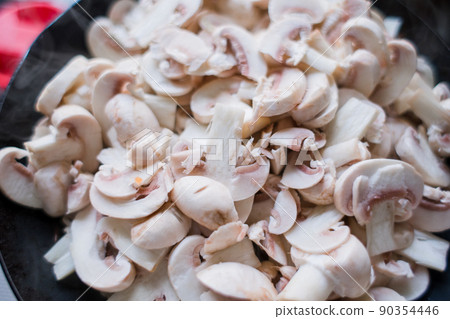 a lot of champignon mushrooms on the table a lot of champignon mushrooms on the table 90354446