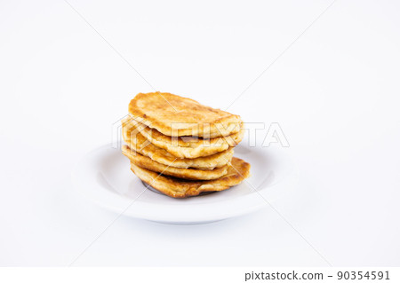 lush tasty fritters on a plate on a white background lush tasty fritters on a plate on a white background 90354591