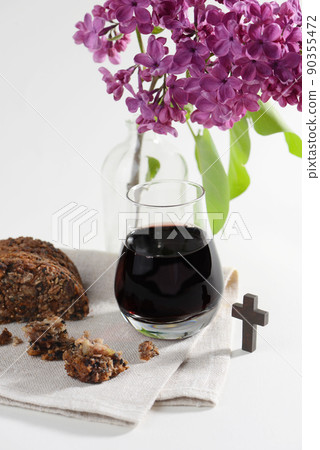The Feast of Corpus Christi Concept. Bread and red wine symbols of Jesus Christ blood and body. The Feast of Corpus Christi Concept. Bread and red wine symbols of Jesus Christ blood and body. 90355472