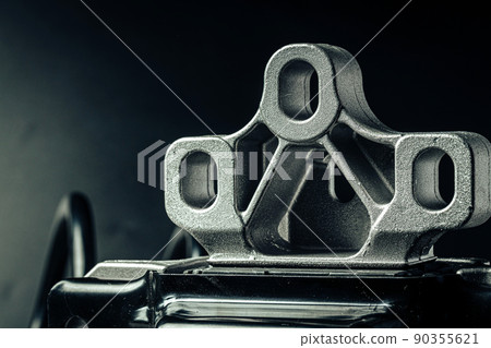 Metal car engine spare part on black background 90355621