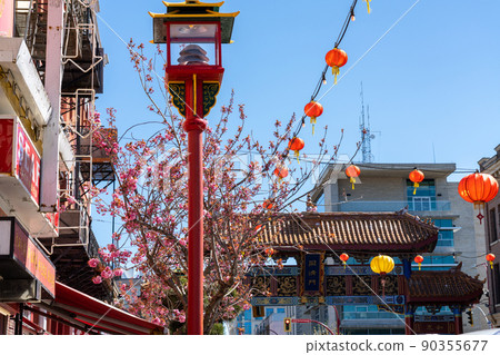 Victoria, BC, Canada - April 14 2021 : Victoria Chinatown, with the Gate of Harmonious Interest in the background. The oldest Chinatown in Canada and the second oldest in North America. Victoria, BC, Canada - April 14 2021 : Victoria Chinatown, with the Gate of Harmonious Interest in the background. The oldest Chinatown in Canada and the second oldest in North America. 90355677