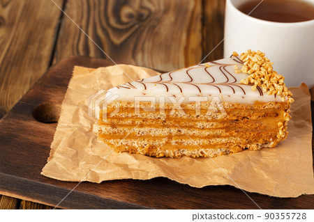 Esterhazi cake piece on a kitchen table 90355728