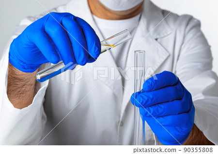 Close up of hands of a scientist working with laboratory samples 90355808