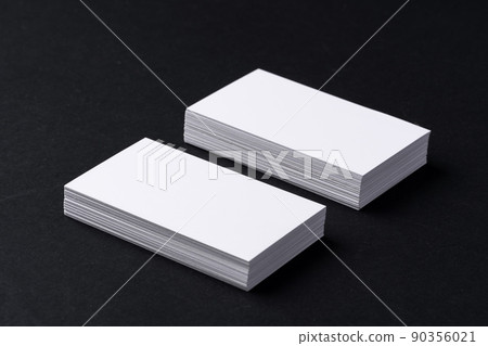 White blank business cards on dark black background 90356021