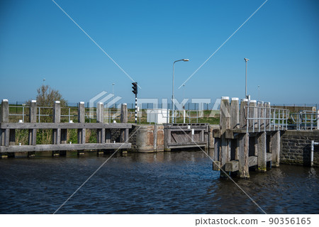 Den Helder, Netherlands, May 2022. Locks and mooring posts at Oostoever in Den Helder. Den Helder, Netherlands, May 2022. Locks and mooring posts at Oostoever in Den Helder. 90356165