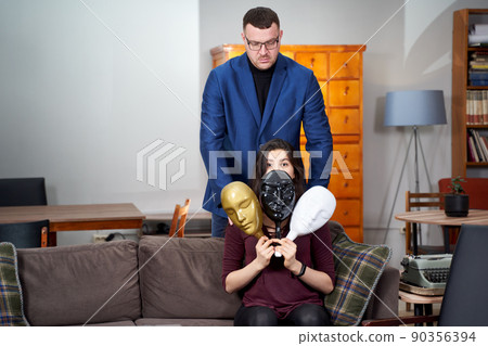 Therapist using plastic masks with female patient during therapy session Therapist using plastic masks with female patient during therapy session 90356394
