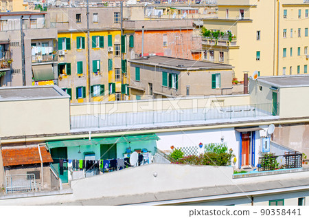 Vintage buildings with rooftops and terraces on sunny day 90358441